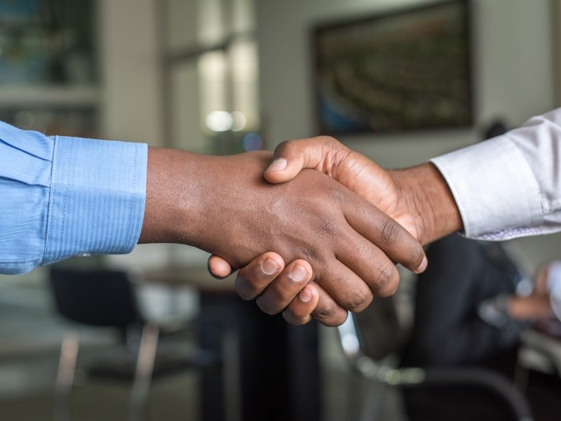 Founder shaking hands on a recapitalization deal